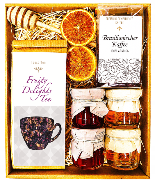 Geschenkkorb mit Tee, Kaffee, Honig und Marmelade