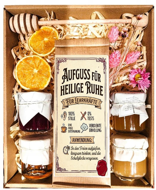 Geschenkkorb mit Blumen, Honig, Tee und Marmelade